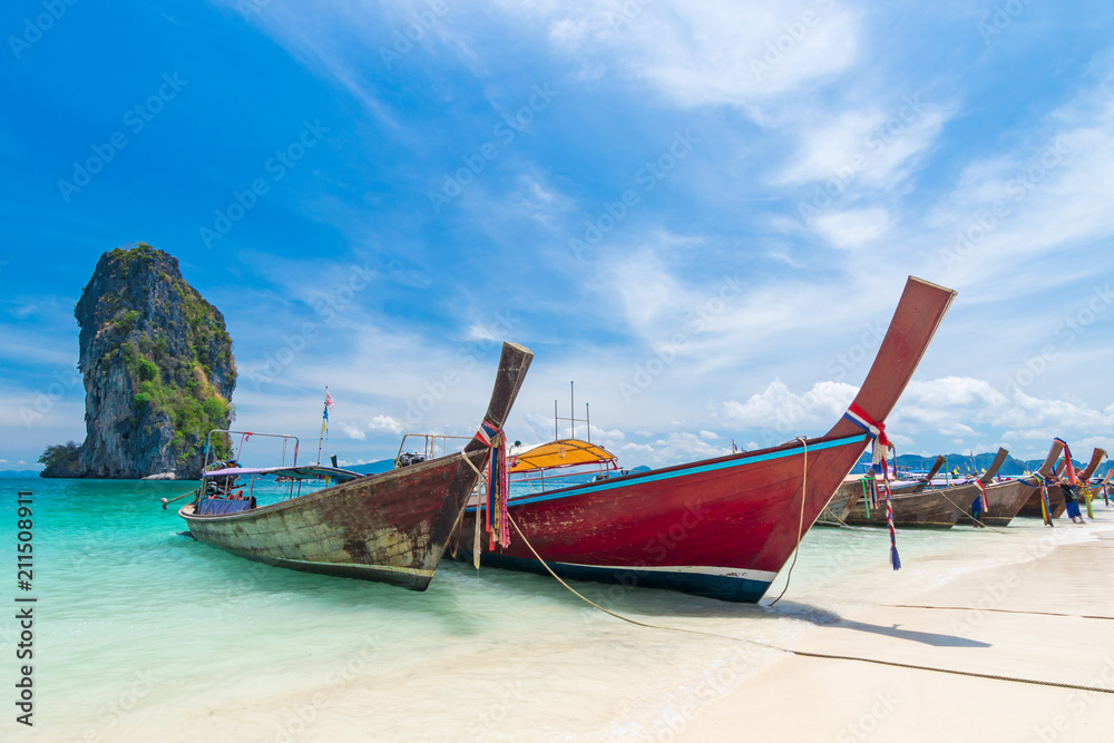 Thai long tail boats on the beach with beautiful island, Krabi Phuket Thailand