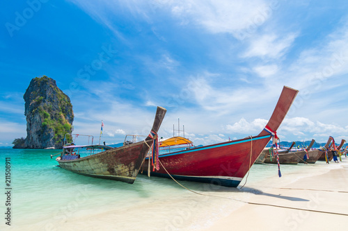 Thai long tail boats on the beach with beautiful island, Krabi Phuket Thailand