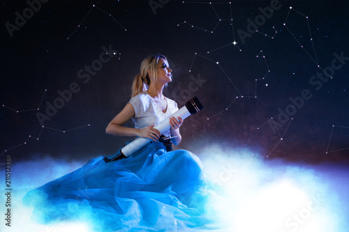 Young woman dreams of the future  concept. Girl above the clouds looks up and uses a telescope. Starry sky