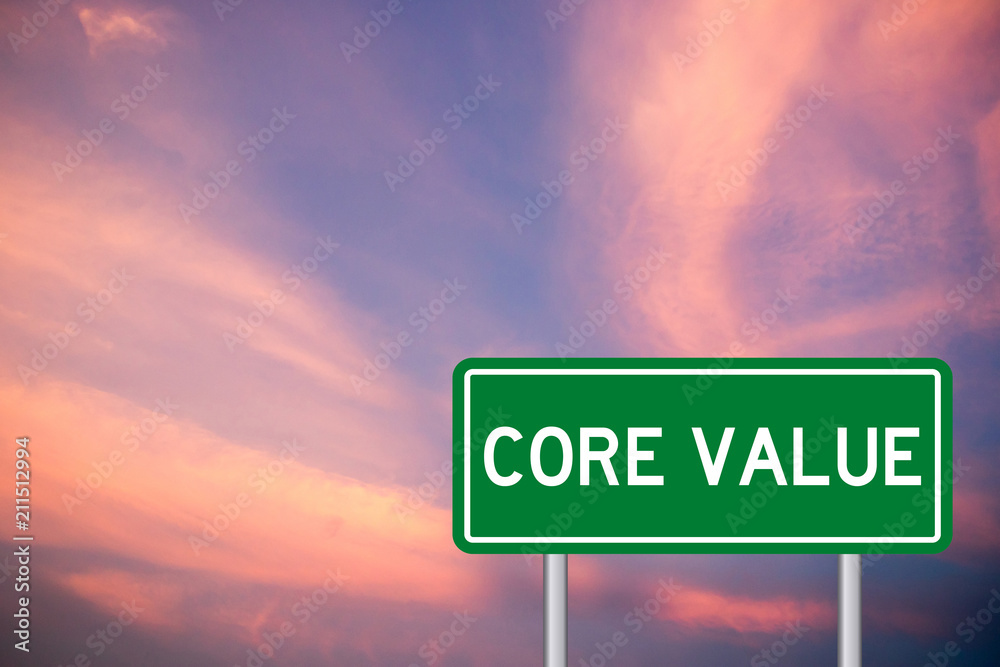 Green transportaion sign with word core value on beautiful pink violet sky background Green transportaion sign with word core value on beautiful pink violet sky background