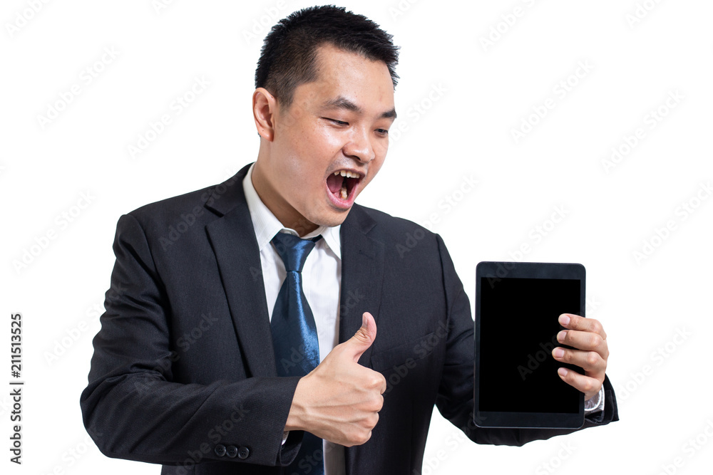 Young business man wear black suit working on digital tablet. Businessman hand holding tablet and hand thumbs up. Shocked and surprised face isolated on white back black ground. Young business man wear black suit working on digital tablet. Businessman hand holding tablet and hand thumbs up. Shocked and surprised face isolated on white back black ground.