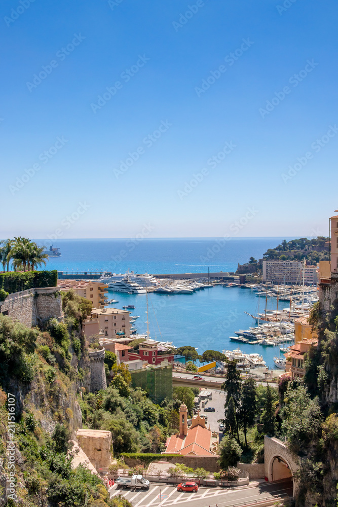 View of Monaco City with boat marina below in Monaco. Monaco City is one of the four traditional quarters.