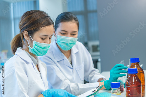 Asian scientist working in the lab Doing experiment for product The researchers analyzed to find the results of the experiment.