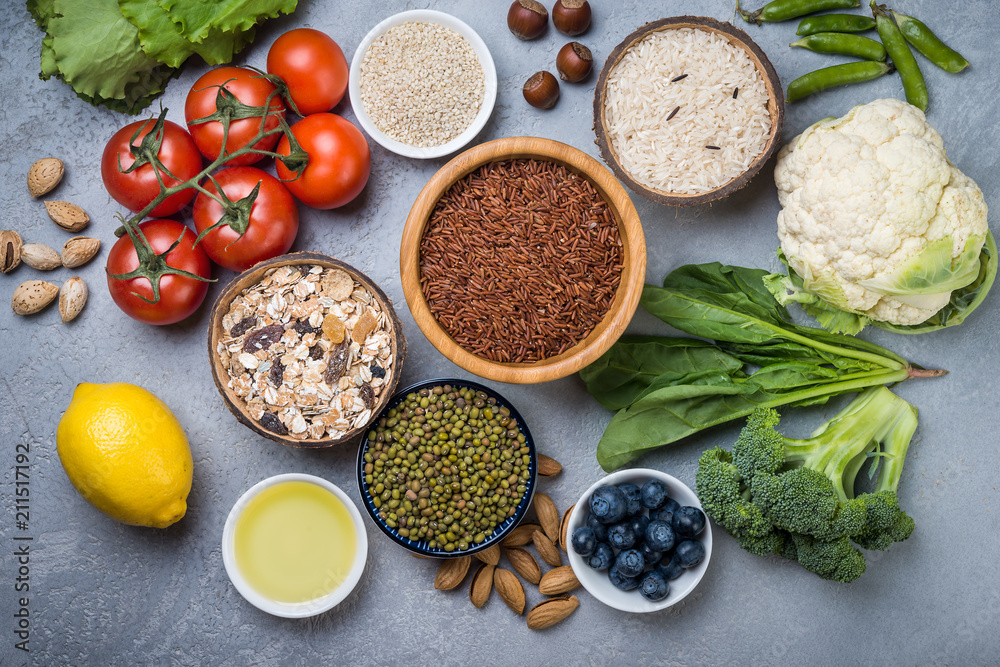 Selection of food for health, cereals, nuts, fruits, vegetables and greens. Flat lay Selection of food for health, cereals, nuts, fruits, vegetables and greens. Flat lay