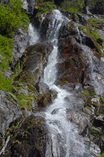 White water jetting down cut in rock face