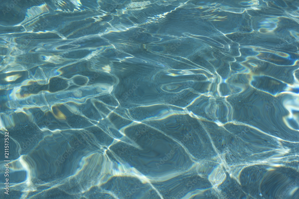 Beautiful caustics on water surface in blue sea Beautiful caustics on water surface in blue sea