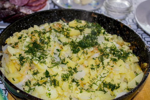 Fried potatoes in an iron pan