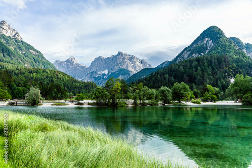Scenic view of the jasna Lake with Julian Alps in the background near Krajnska Gora, Slovenia photo