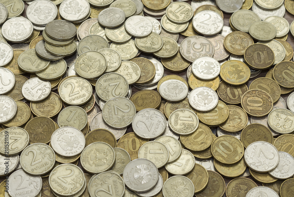 Russian bimetallic coins, worth one, two, five and ten rubles, located obverse and reverse, level surfaces Russian bimetallic coins, worth one, two, five and ten rubles, located obverse and reverse, level surfaces