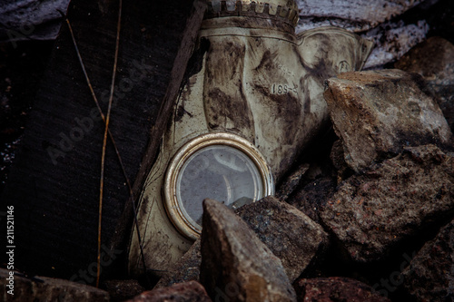 Respirator mask for gas on the background of trash. photo