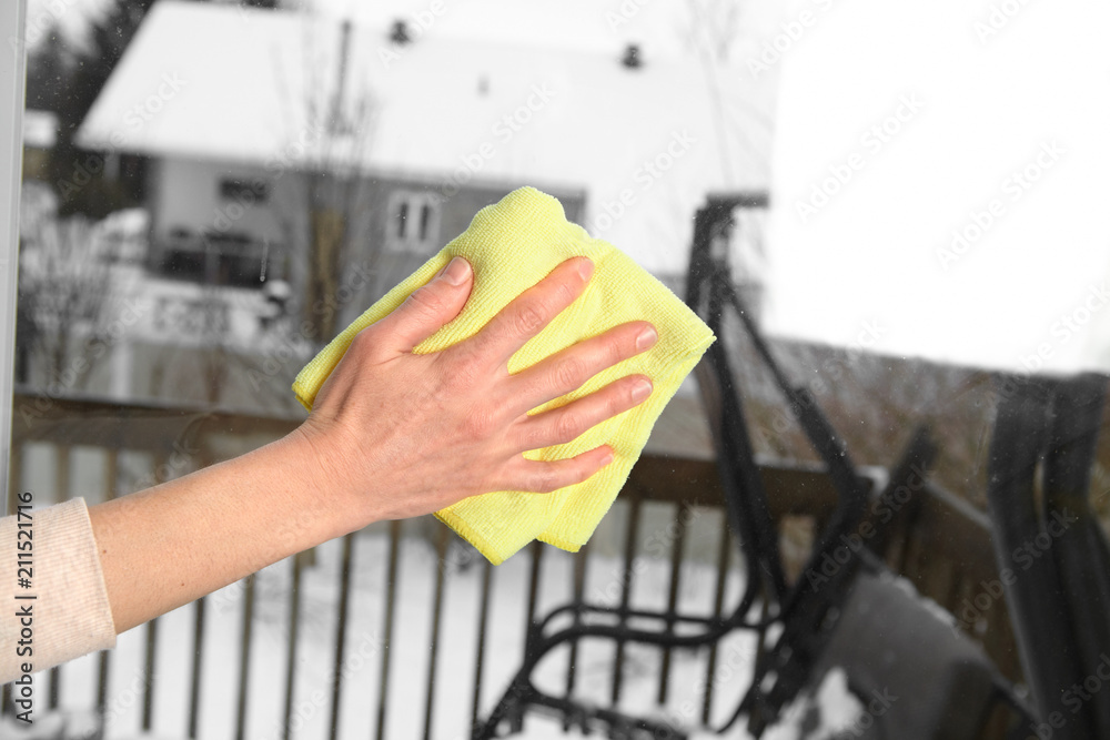 Woman washes a window Woman washes a window