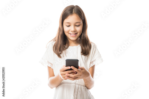 Young latin girl in white blouse using smartphone