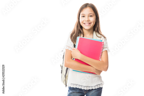 Young hispanic student girl holding books