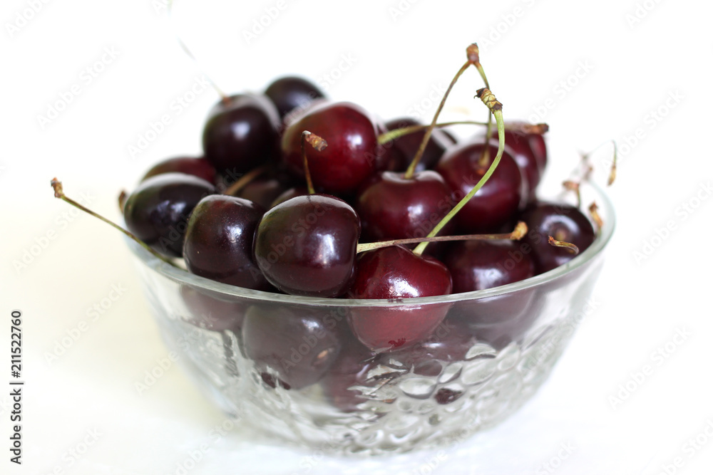 cherry fruit in glass bowl on white background. cherry fruit in glass bowl on white background.