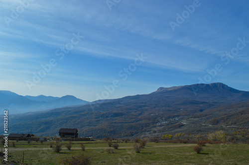 view of the mountains from the valley. The Crimean mountains are shrouded in a bluish haze. 