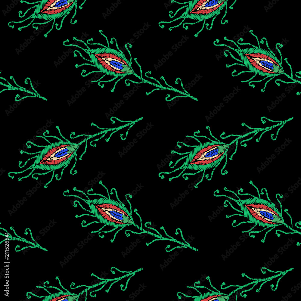Embroidery peacock feathers isolated on the black background