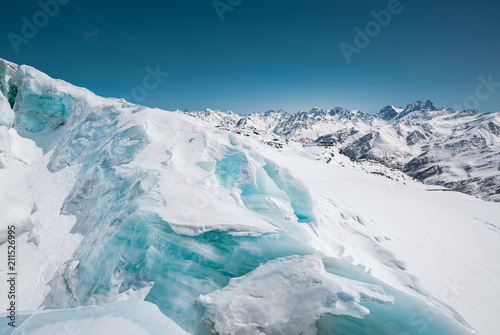 A close-up of snow-covered cracks in the Elbrus volcano glacier. North Caucasus