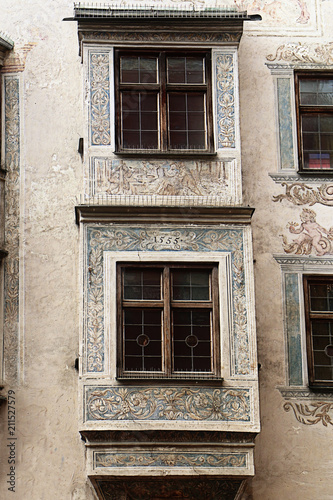 Wasserburg am Inn, Upper Bavaria, Germany - detail of Ganserhaus facade, building dated 1555 in the medieval old town, with painted decorations around the jutted windows © acrogame