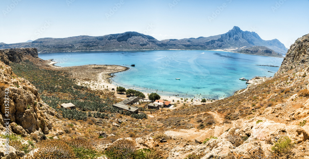 Panorama: Balos Lagoon Turquoise and Blue sea, view from the cliff of the island fort, Crete Island, Greece
