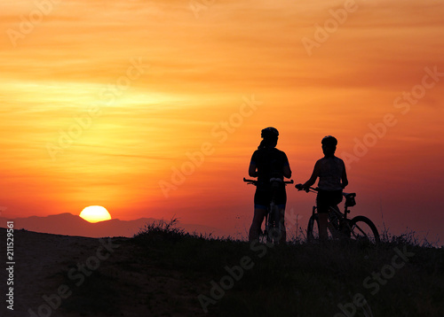 Mountain bikers at sunset