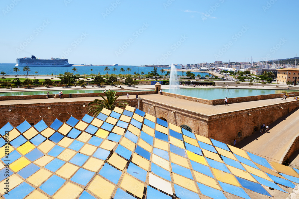 The view on shore and fountain near Cathedral of Santa Maria of Palma in Palma de Mallorca, Spain