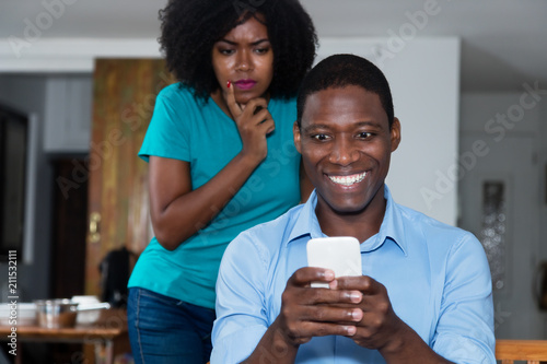 Jealousy african american woman distrust her boyfriend photo