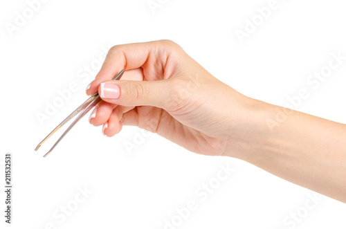 Tweezers for eyebrows in hands on white background isolation
