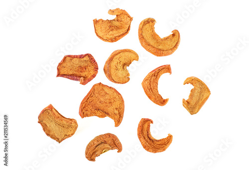 Slices of dried apple isolated on white background, top view.