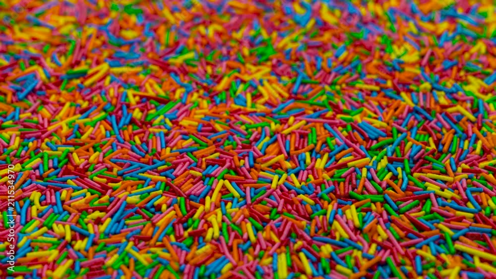Camera moves diagonally thru a heap of colored sugar strands. Camera moves diagonally thru a heap of colored sugar strands.
