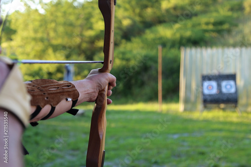 Archery / Shooter prepares for the shot and aims to shoot the bow in the target / Fragments