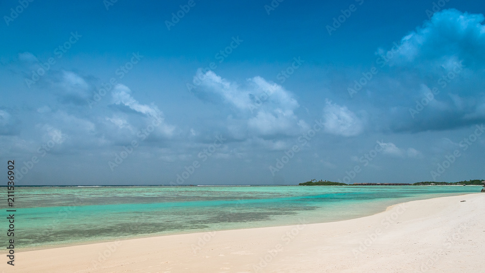 Maldives beautiful beach background white sandy tropical paradise island with blue sky sea water ocean	