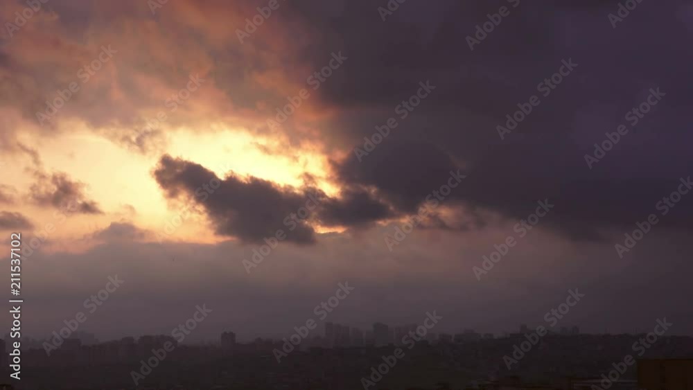 Beautiful time lapse sunset on the cloudy sky over city, Turkey Beautiful time lapse sunset on the cloudy sky over city, Turkey
