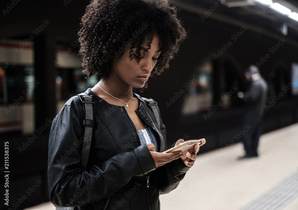 Black woman inside the underground station waiting for the train Stock ...