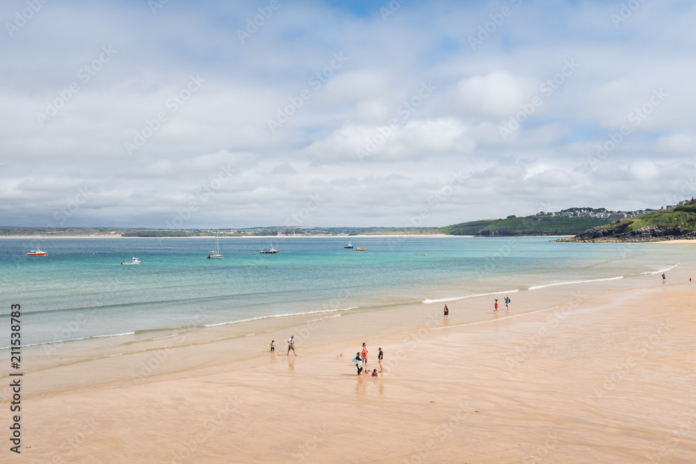 Families in the water's edge on Porthminster Beach, St Ives, Cornwall.
