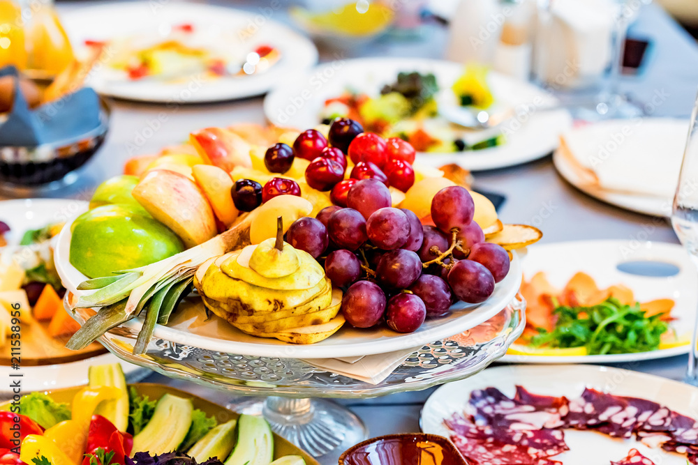 Beautiful fruit plate on festive table Beautiful fruit plate on festive table