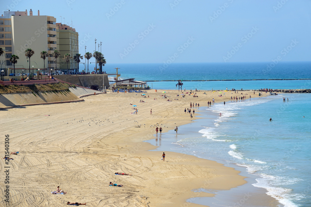 Cádiz, Spain - June 21, 2018: Beach line with bathers in Cadiz.