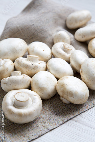 Fresh raw champignon mushrooms, side view. Close-up.