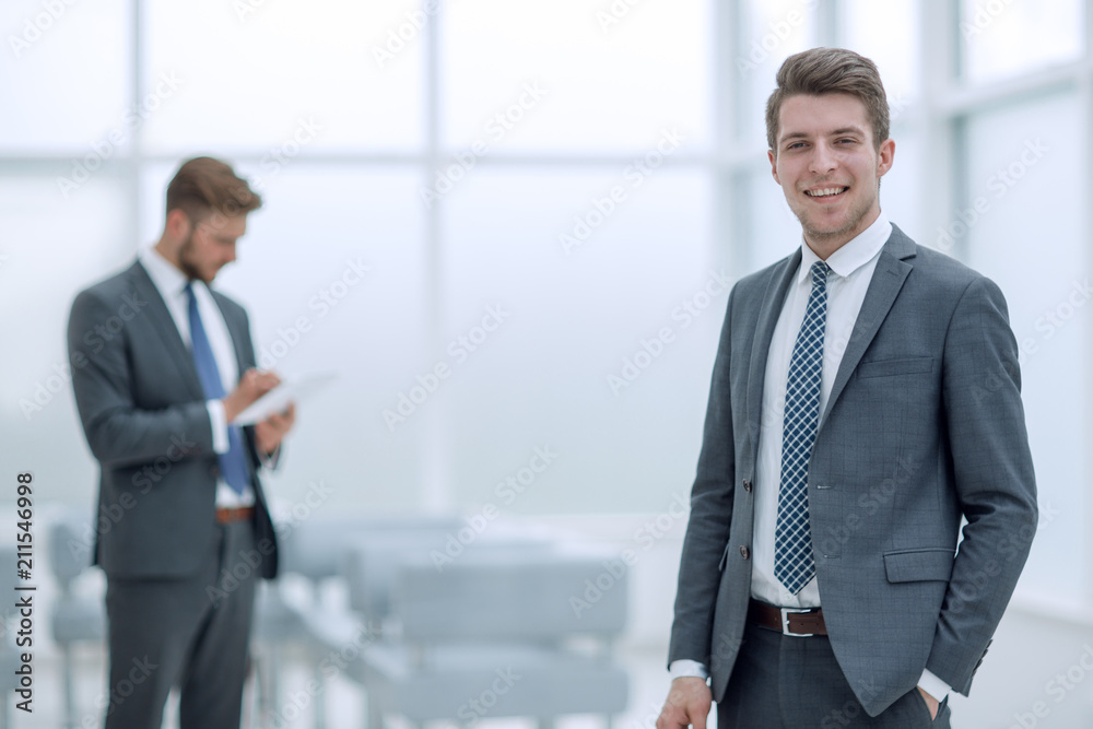 successful businessman on the background of the office successful businessman on the background of the office