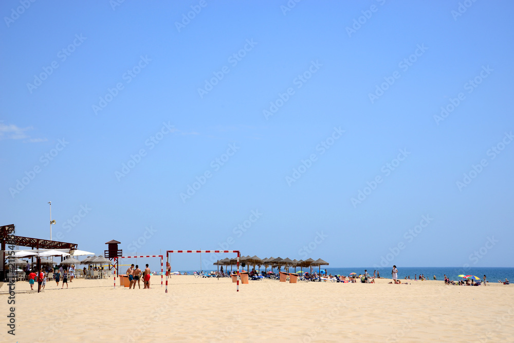 Cádiz, Spain - June 21, 2018: Beach line with bathers in Cadiz.