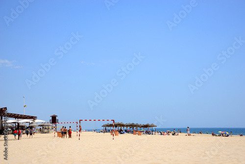 C  diz  Spain - June 21  2018  Beach line with bathers in Cadiz.