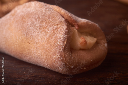 Cookies with Cottage cheese baked in oven, on wooden table and black background. Close up, selective focus. Concept of homemade food