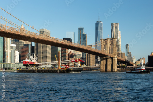 New York City / USA - JUN 25 2018: Brooklyn Bridge Park with Lower Manhattan skyline at sunrise