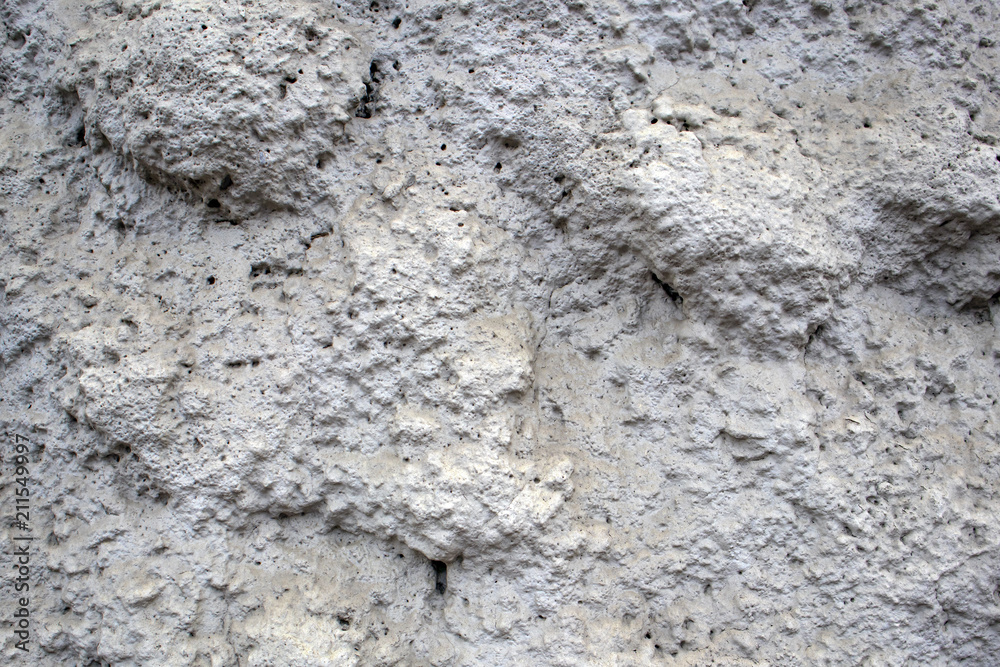 Porous spongy gray facing stone texture, may be used as background