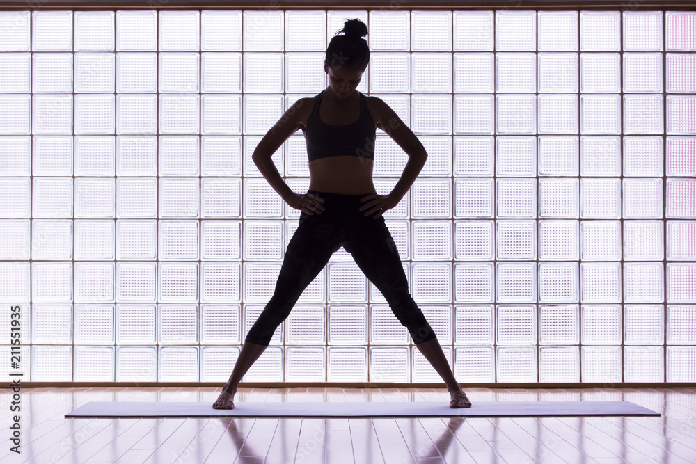 Woman practicing yoga indoors. Woman practicing yoga indoors.
