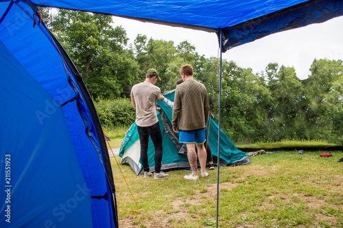 family preparing the tent in camping trip