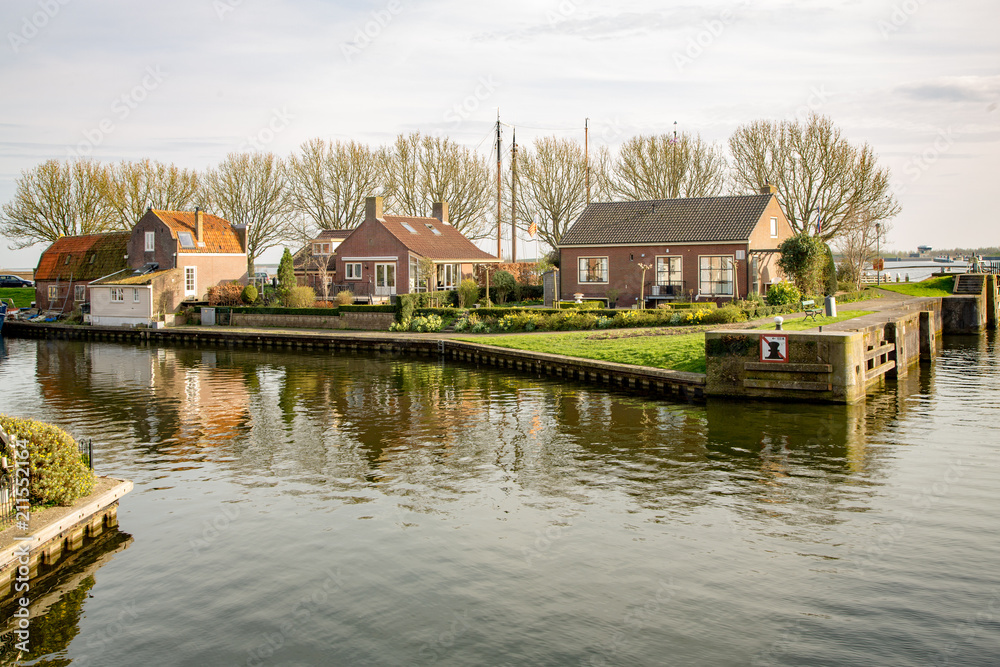 Homes Reflected in the Canal in Enkhuizen, The Netherlands
