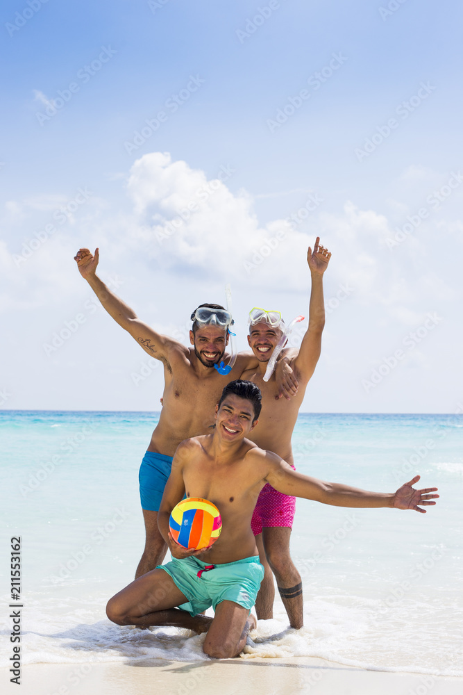 Group of male friends having fun at the beach Group of male friends having fun at the beach
