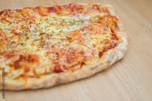 Pizza calzone time on light wooden table background
