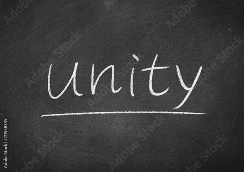 unity concept word on a blackboard background