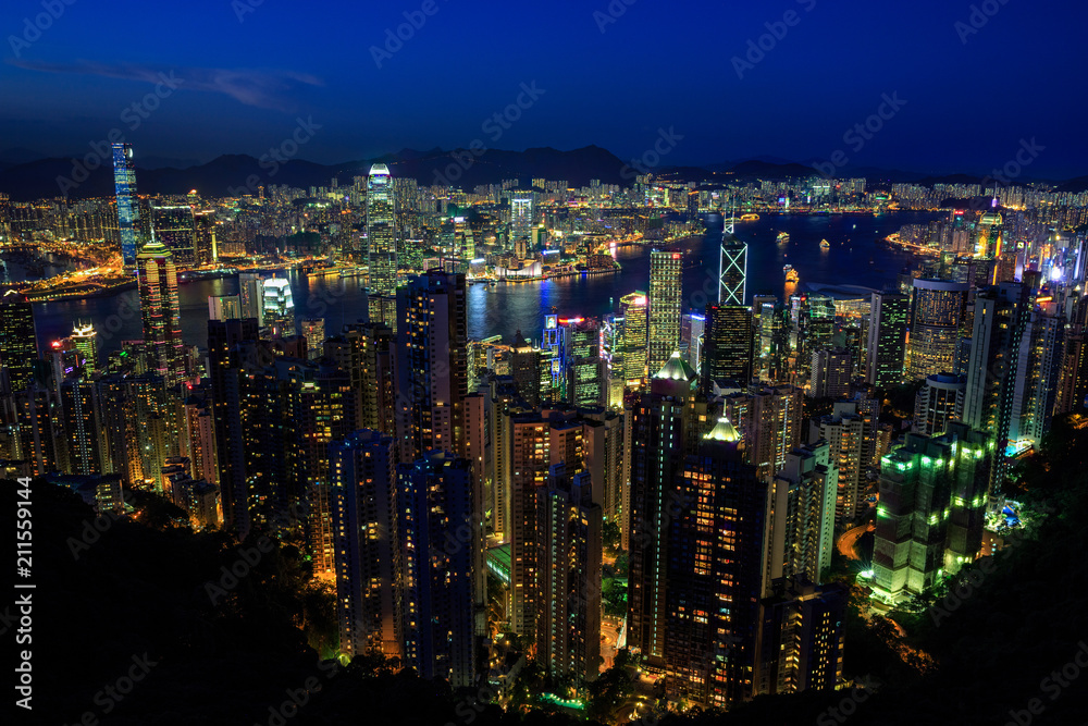 Hong Kong City Skyline at night time, photo taken from a nearby mountain (Victoria Peak) overlooking the city